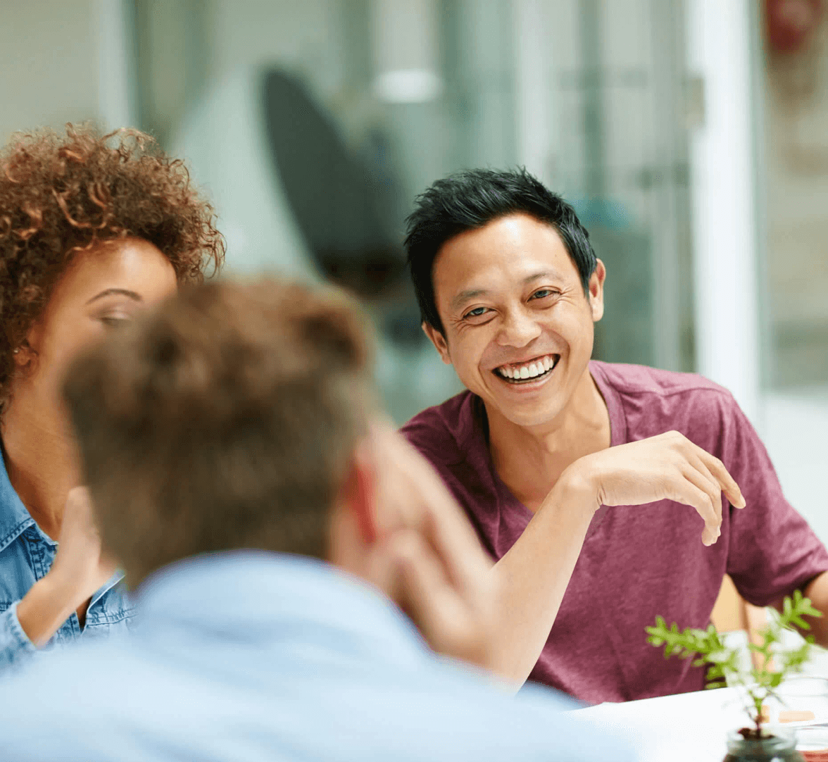 Man smiling with friends