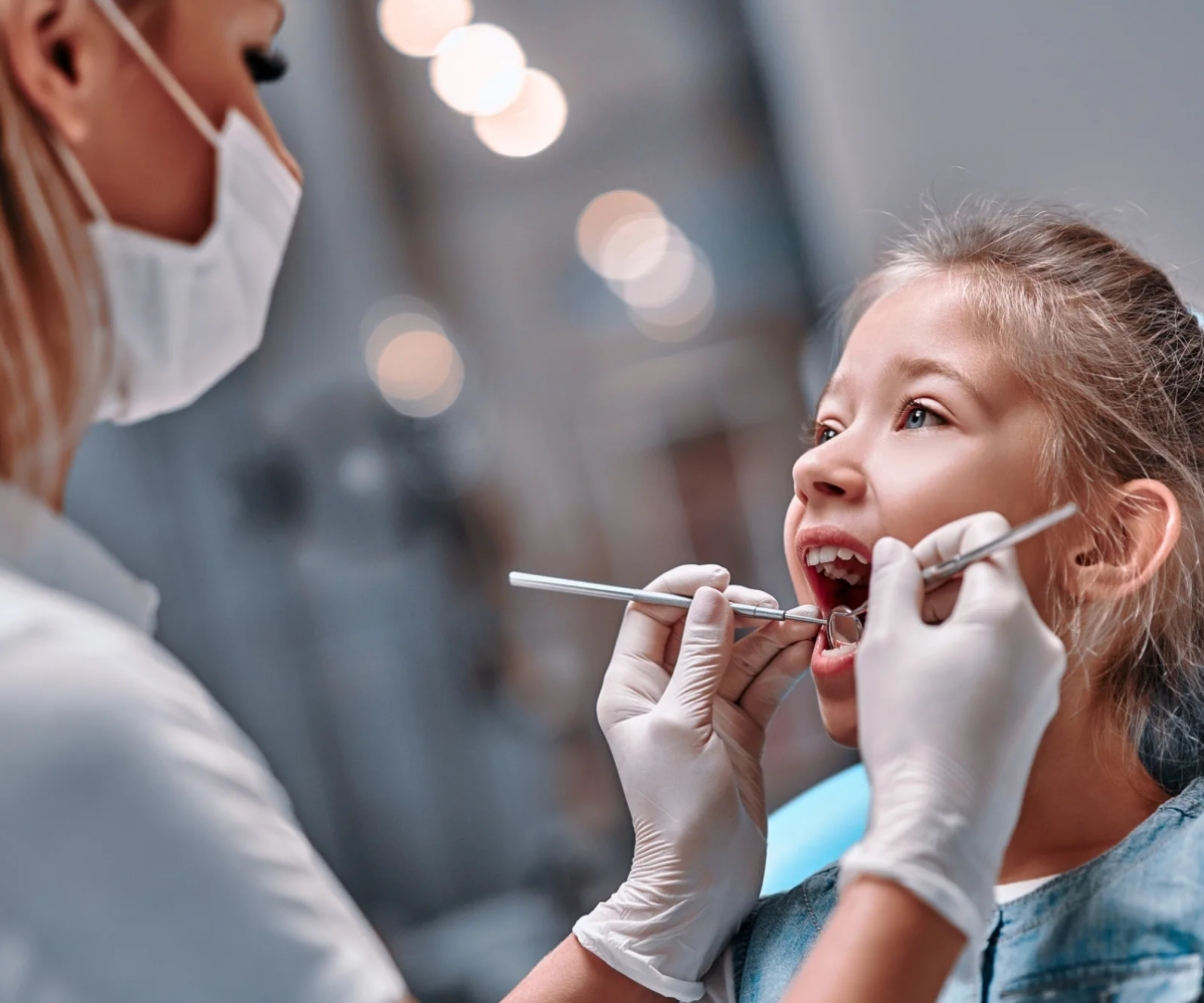 Child getting teeth examined