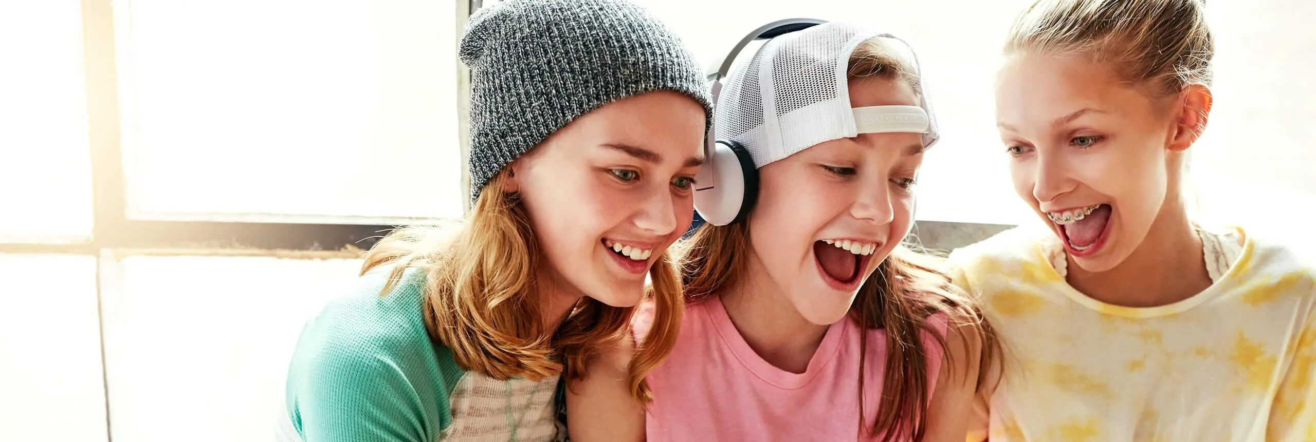 Three girls smiling
