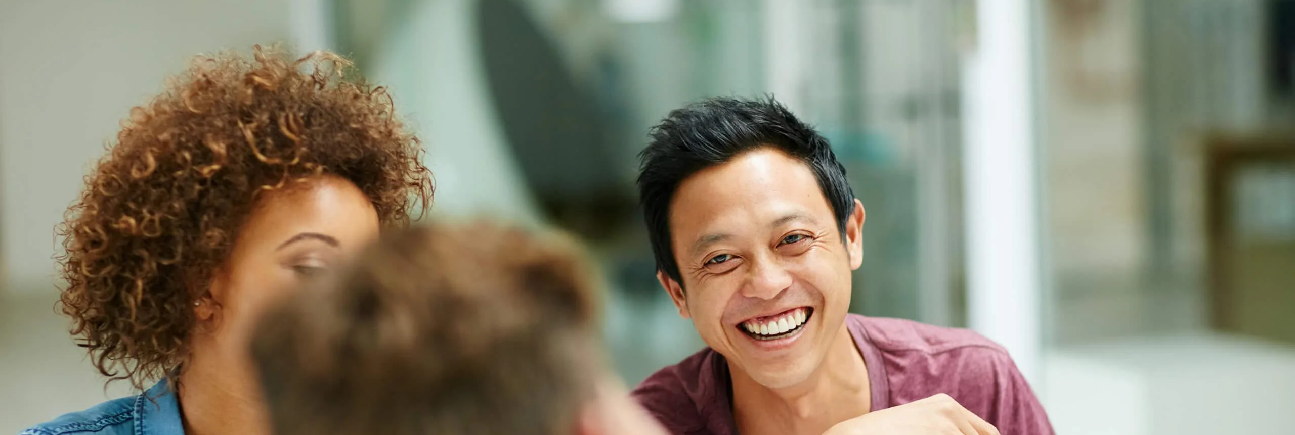 Man smiling with friends